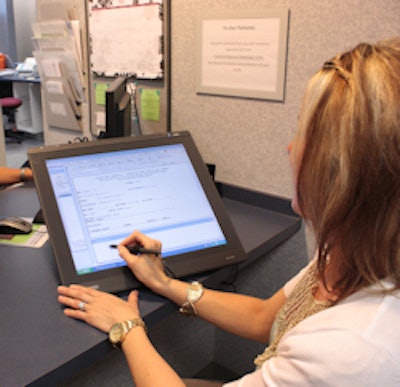 Patient at interactive pen display cubicle. Image courtesy of Valley Regional Imaging.