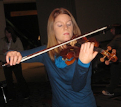Violinist Brigid McCarthy plays the Betts copy.