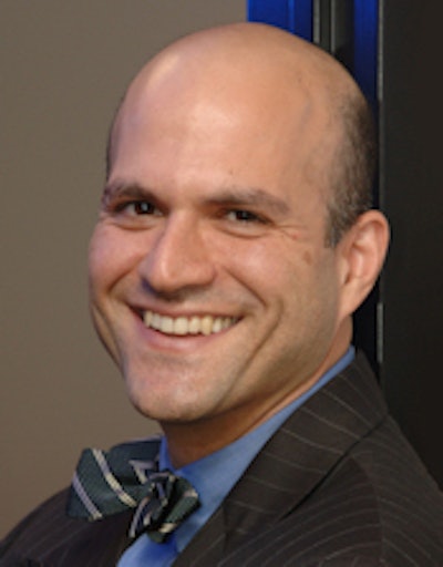 Dr. Farzad Mostashari discussed the goals of the ONC meaningful use IT stimulus program at HIMSS 2013. Image courtesy of HIMSS.