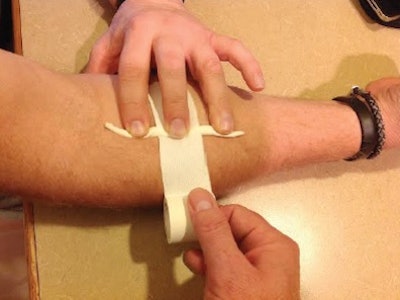 Figure 3: Place tape around the forearm.