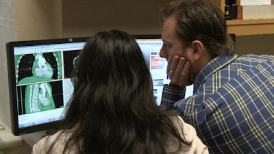 Dr. Matthew Bramlet and a colleague review cardiac CT images.