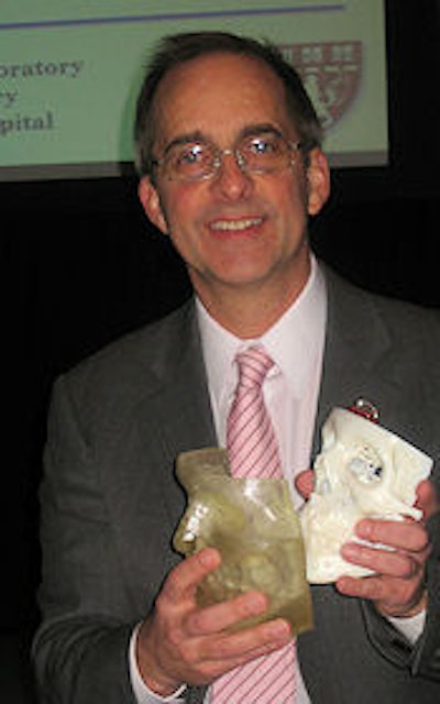 Dr. Frank Rybicki with the 3D-printed skull and face.