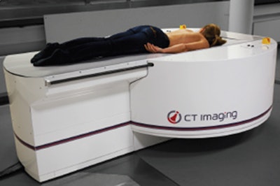 A breast CT scanner with the patient in prone position with one breast being imaged at a time (typically 10 seconds or less) and without compression. Image courtesy of Dr. Willi Kalender.
