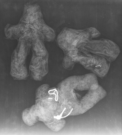 Three dolls made of red fabric.