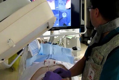 Operator uses virtual reality video guidance to advance the needle toward a target in the paraspinal muscles of a pig. Image courtesy of Dr. John Racadio.