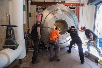 The scanner was detached from the crane, moved into the building, and slowly pushed down the service corridor into its specially designed room. The process took several hours. All images and video courtesy of BWH.
