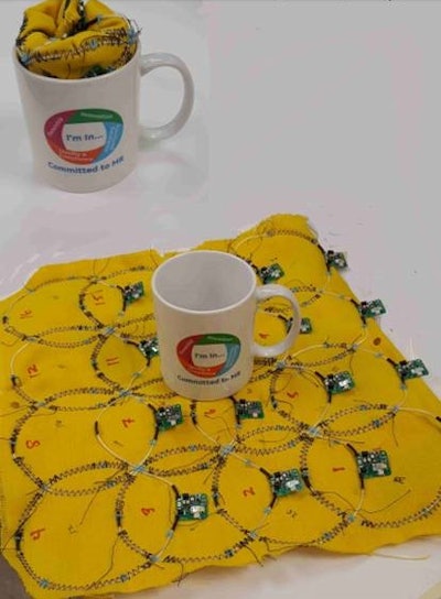 GE's flexible AIR coils can fit inside a coffee mug and function after unfolding. Image courtesy of GE Healthcare.