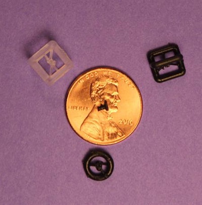 A size comparison between a 3D-printed prosthetic hearing implant and various small objects. Image courtesy of RSNA.
