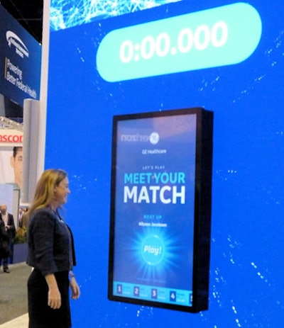 Woman looking at Match Game display with timer