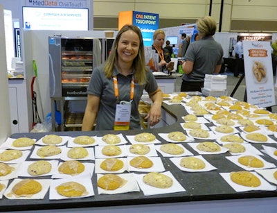 Woman standing in front of counter full of cookies