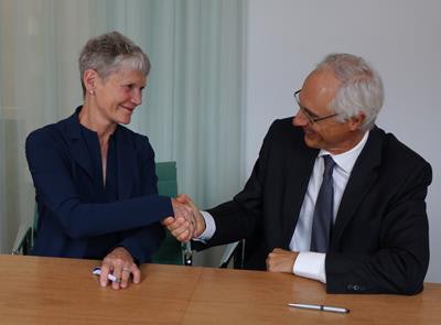 Anne Le Grand, general manager of the Imaging, Life Sciences, and Oncology unit at IBM Watson Health (left), with Yves L'Epine, PhD, CEO of Guerbet (right). Image courtesy of IBM Watson Health.