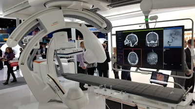 Siemens is showing its Artis icono angiography system integrated with a Corindus endovascular robot.
