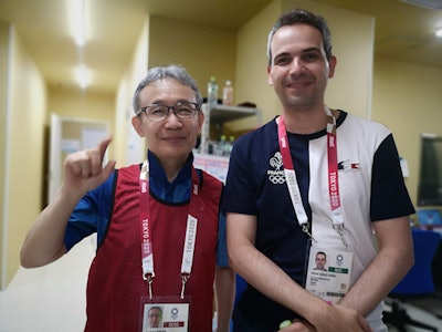 Prof. Kunihiko Fukuda, former chair of radiology at the Tokyo Jikei University School of Medicine, is working at the Olympic Village as a volunteer radiologist in charge of MRI reporting. He is shown here with radiologist Dr. Michel Crema, who is working with the French National Team at the Games. Image courtesy of Prof. Kunihiko Fukuda.