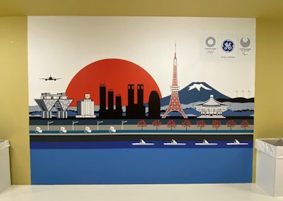 This poster of Tokyo 2020 hangs on the wall of the polyclinic in the Olympic Village. Photo courtesy of General Electric.