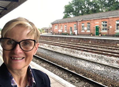 Dr. Kath Halliday says she doesn't mind train rides, but she got a bit sick and tired of staying in budget hotels.