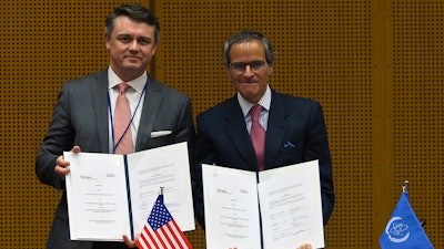 Chris McKee, senior vice president of strategy and business development at MD Anderson Cancer Center (left) and Rafael Mariano Grossi, IAEA Director General (right). The two organizations have signed an agreement that will see the cancer center become an IAEA Collaborating Centre.