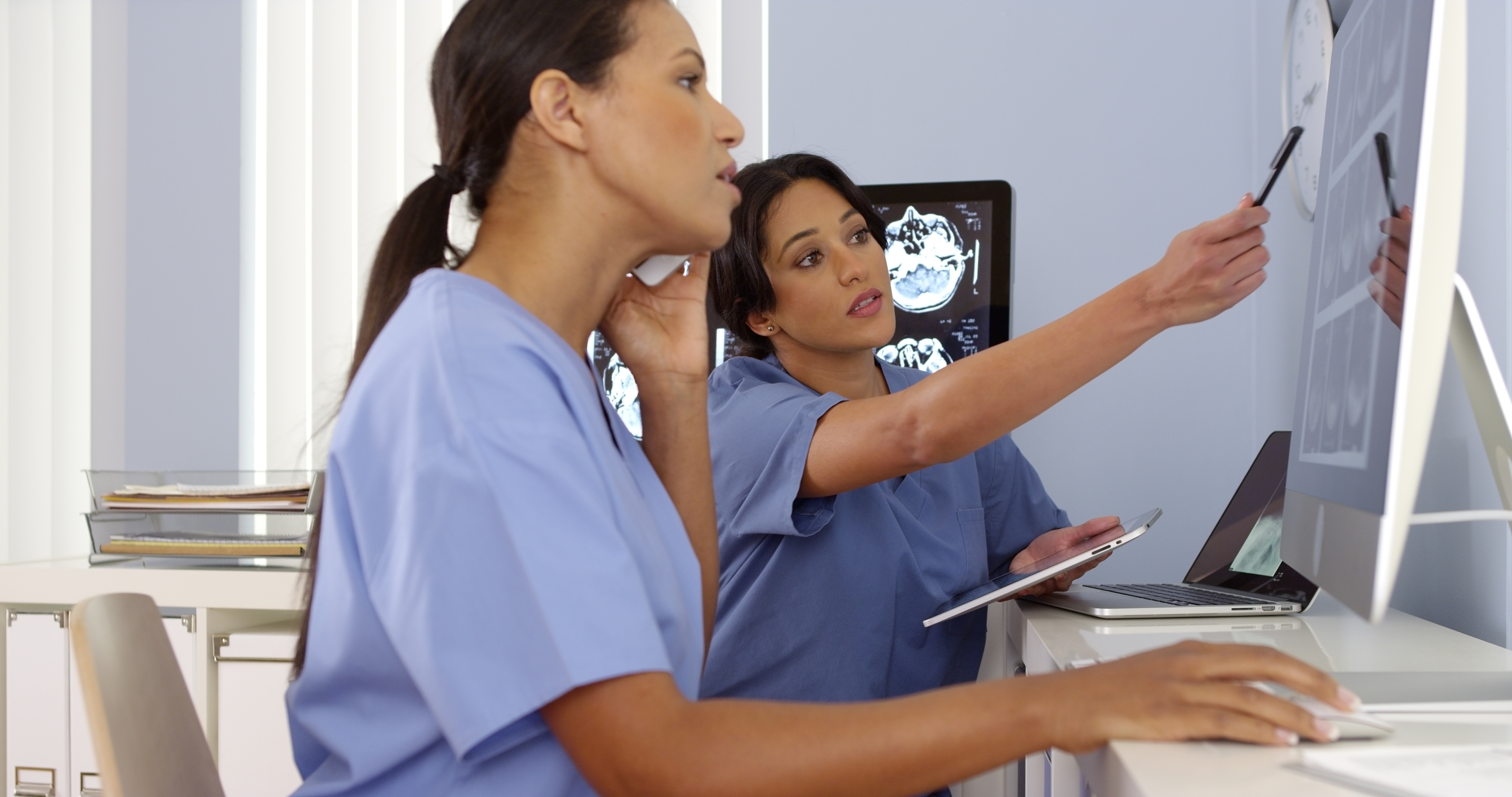 Doctors Working Monitor Consult