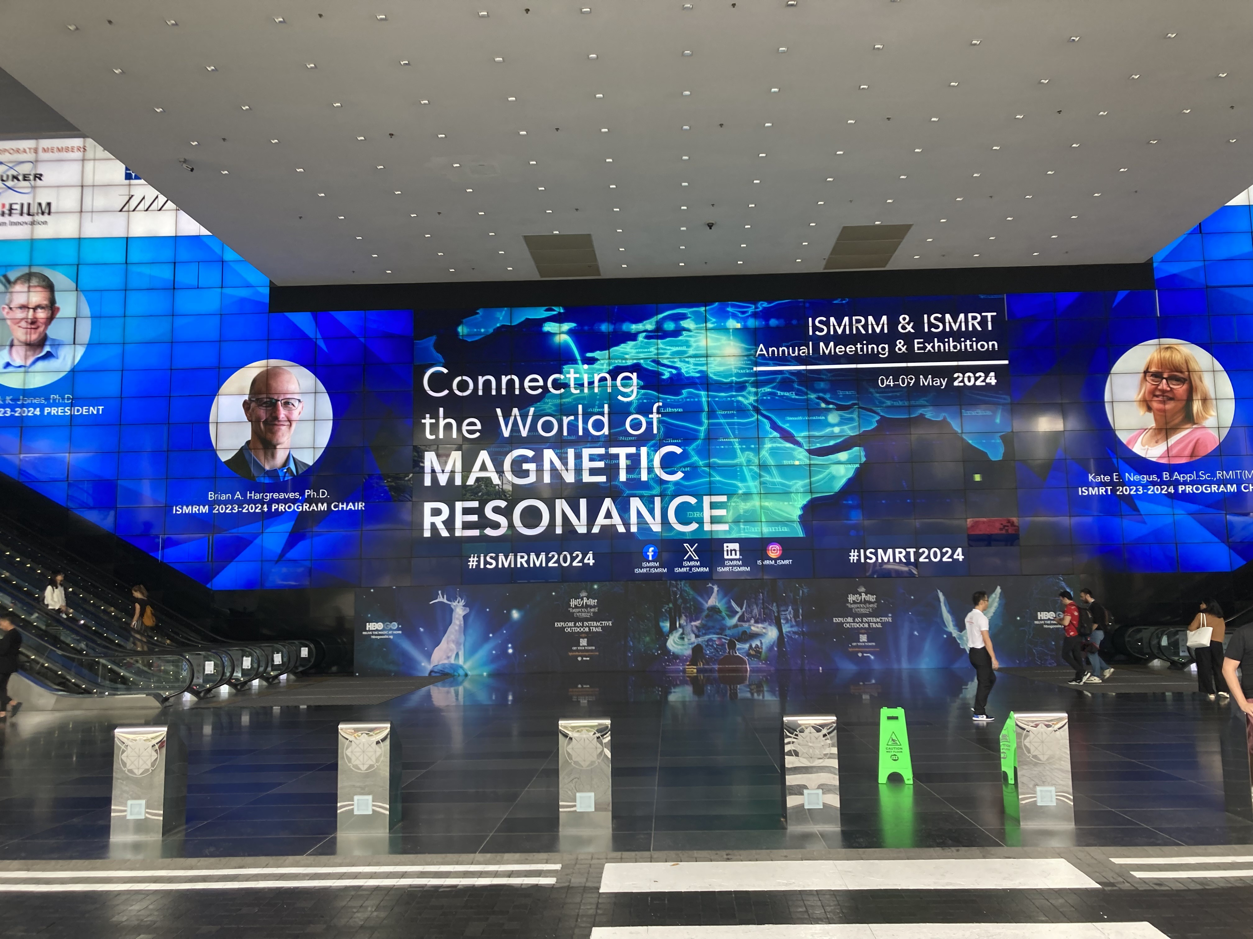 The welcome display feature revolving themes highlighting key presenters.