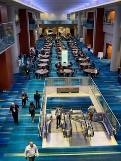 An upper balcony offered views of one of the main floors in the convention center, with meeting rooms to the left and right, and a coffee shop in the background.