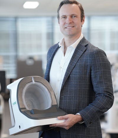 EMVision co-founder and CEO Scott Kirkland displays the proof-of-concept device. Image courtesy of EMVision.
