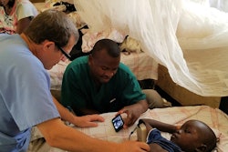 The clinical team perform an ultrasound scan at the Nyankunde Hospital, the Democratic Republic of the Congo, where Warren Cooper, MD, has performed operations ranging from repairing broken bones to craniotomies for over a decade.