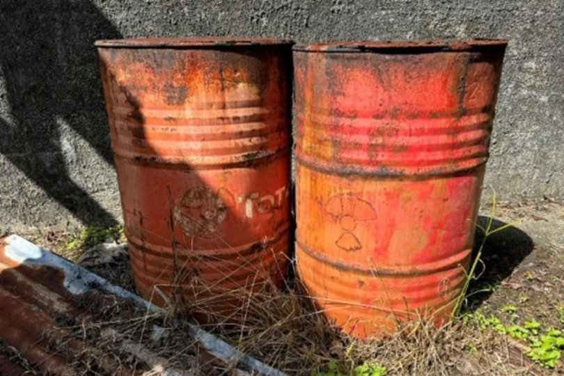 The steel drums were directly exposed to the elements and suffered extensive corrosion. Image and caption courtesy of the IAEA.