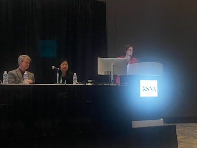 Sarah Eskreis-Winkler, MD, PhD, discusses results from a study she and colleagues led evaluating the performance of FDA-approved AI tools in real-world clinical settings. Sitting next to her are session moderators Ritse Mann, MD, PhD (left), and Linda Moy, MD.