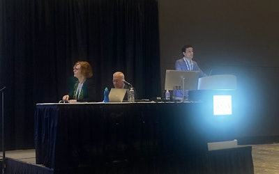 Jorge Rey Porras, MD, discusses results from his team's study on cryoablation for treating early-stage breast tumors in older women. Next to him include session moderators Sarah Vinnicombe (left) and Steven Poplack, MD (middle).