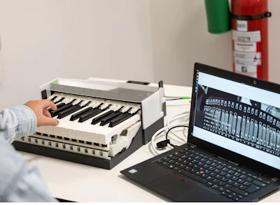 Researchers at ISMRM presented results from a proof-of-concept study showing how a 7T MRI-compatible piano could potentially help take neural measurements.