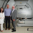 (From left to right) Researchers Emily Daugherty, MD, Anthony Mascia, PhD, and John Perentesis, MD, inside the proton therapy treatment room at the Cincinnati Children's/University of Cincinnati Medical Center Proton Therapy Center.