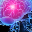 Glowing human brain illustration with blue and pink lighting on dark background