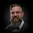 Professional headshot of a bearded man wearing glasses and formal attire with bow tie Headshot