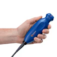 Hand holding blue Casco handheld device with black cable against white background