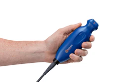 Hand holding blue Casco handheld device with black cable against white background