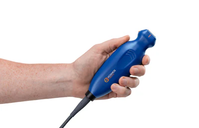 Hand holding blue Casco handheld device with black cable against white background