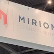 Mirion Technologies corporate logo and text displayed on white trade show booth signage